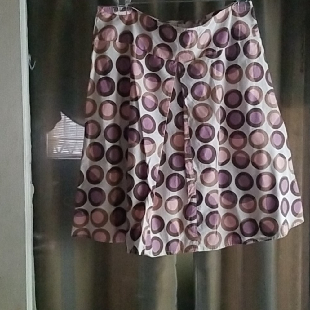White skirt with purple/pink circles